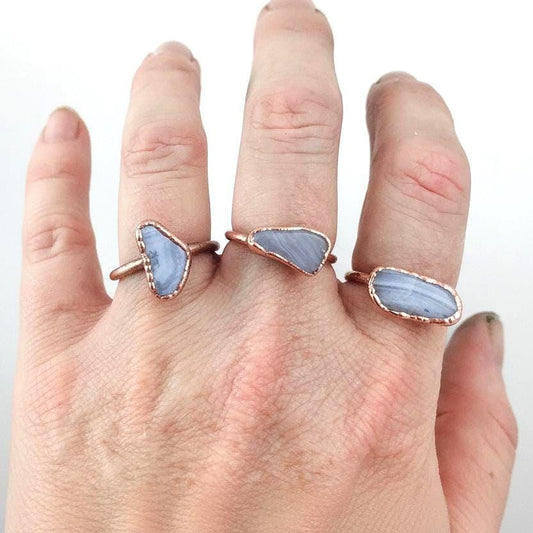 Blue lace agate electroformed copper ring worn on woman's hand, handmade boho copper jewelry
