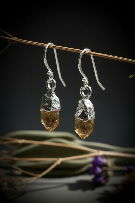 Silver plated raw citrine earrings hanging on dried branch