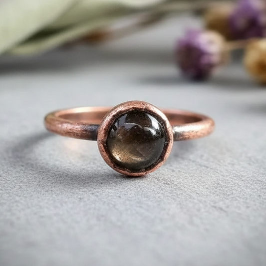 Black moonstone single ring hero on light grey slate