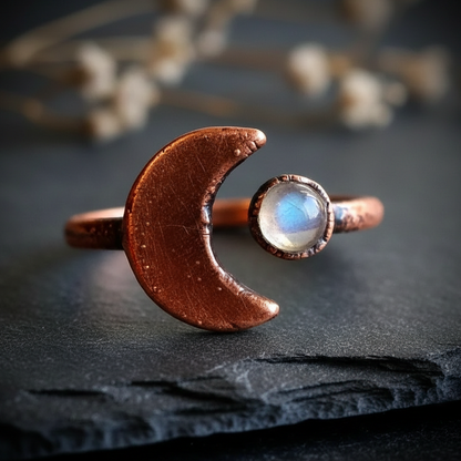 Crescent moon bypass ring hero on dark charcoal slate