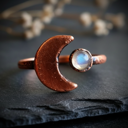 Crescent moon bypass ring hero on dark charcoal slate