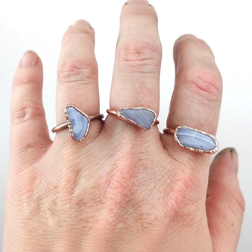 Blue lace agate electroformed copper ring worn on woman's hand, handmade boho copper jewelry