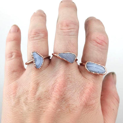 Blue lace agate electroformed copper ring worn on woman's hand, handmade boho copper jewelry
