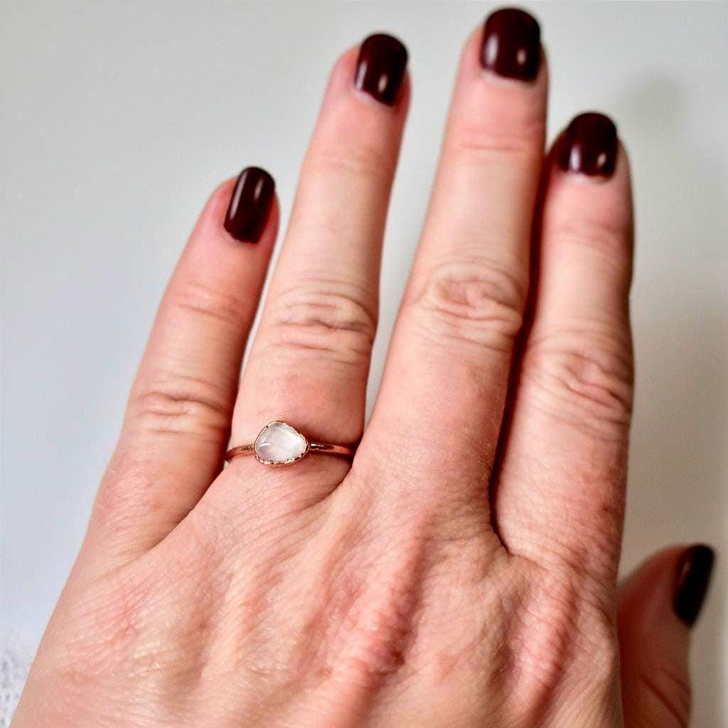 Dainty rose quartz copper ring worn on hand, showing stone size and fit, made to order