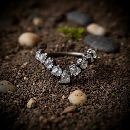 Raw clear quartz chevron ring close-up detail showing dark antique copper bezels and milky quartz crystals