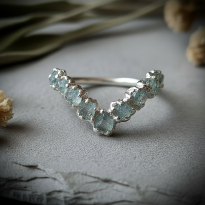 Raw aquamarine sterling silver chevron ring, top-down arc view showing all 9 stones