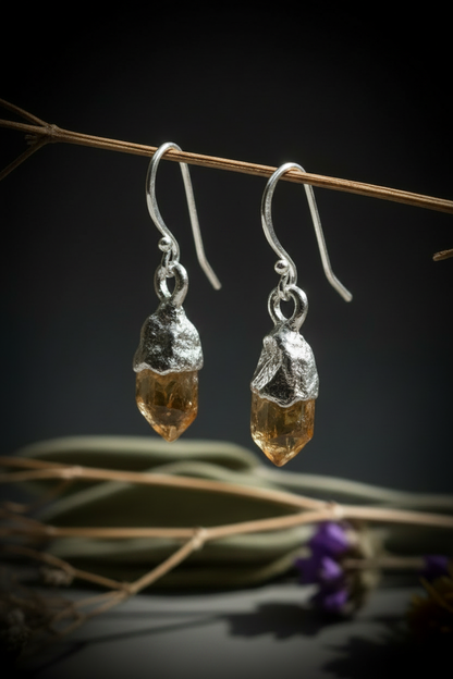 Silver plated raw citrine earrings hanging on dried branch