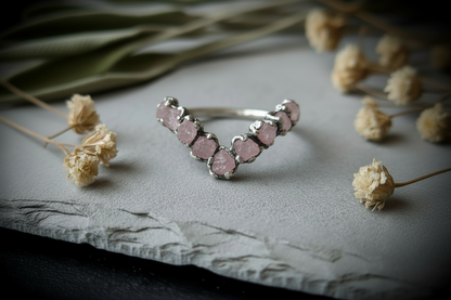 Raw rose quartz chevron ring silver-plated on light grey slate with dried botanicals