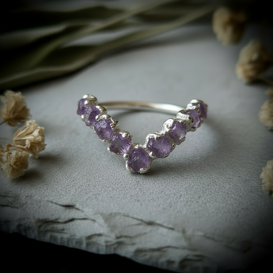 Raw amethyst silver-plated chevron ring hero close-up on light grey slate