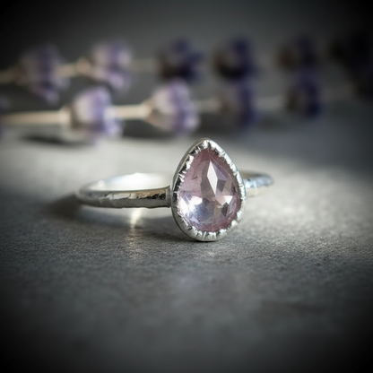 Lavender amethyst faceted pear ring in silver plated electroformed copper, hero upright on light grey slate