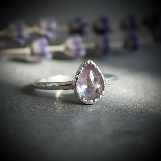 Lavender amethyst faceted pear ring in silver plated electroformed copper, hero upright on light grey slate