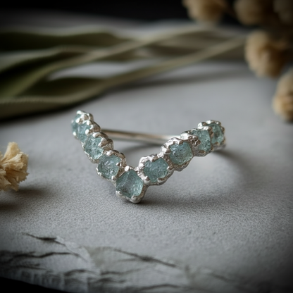 Raw aquamarine sterling silver chevron ring, 3/4 angle with slate edge