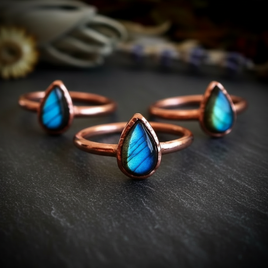Labradorite trio cluster on dark charcoal slate