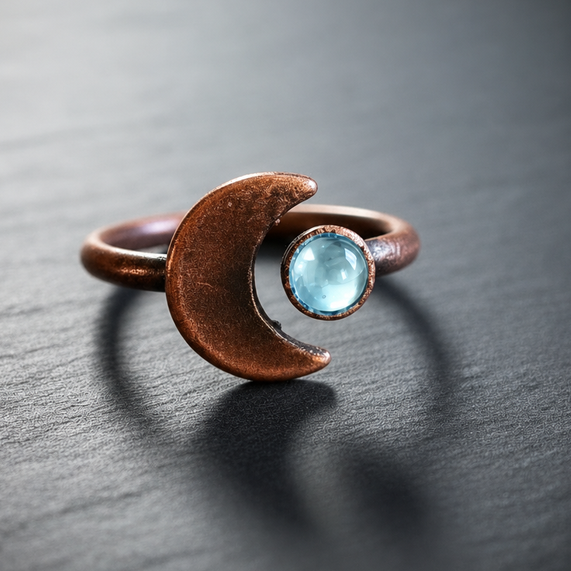 Light blue topaz crescent moon ring hero close-up