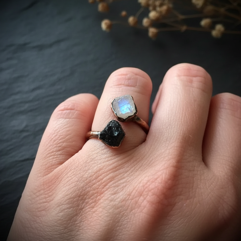 Moonstone tourmaline bypass ring hand shot 1 on dark charcoal slate
