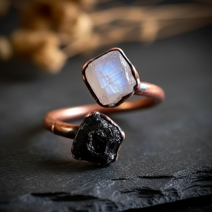 Moonstone tourmaline bypass ring hero on dark charcoal slate