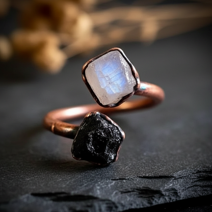 Moonstone tourmaline bypass ring hero on dark charcoal slate