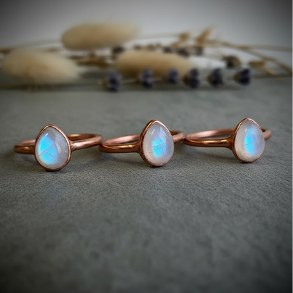 Teardrop moonstone rose copper row on dark slate